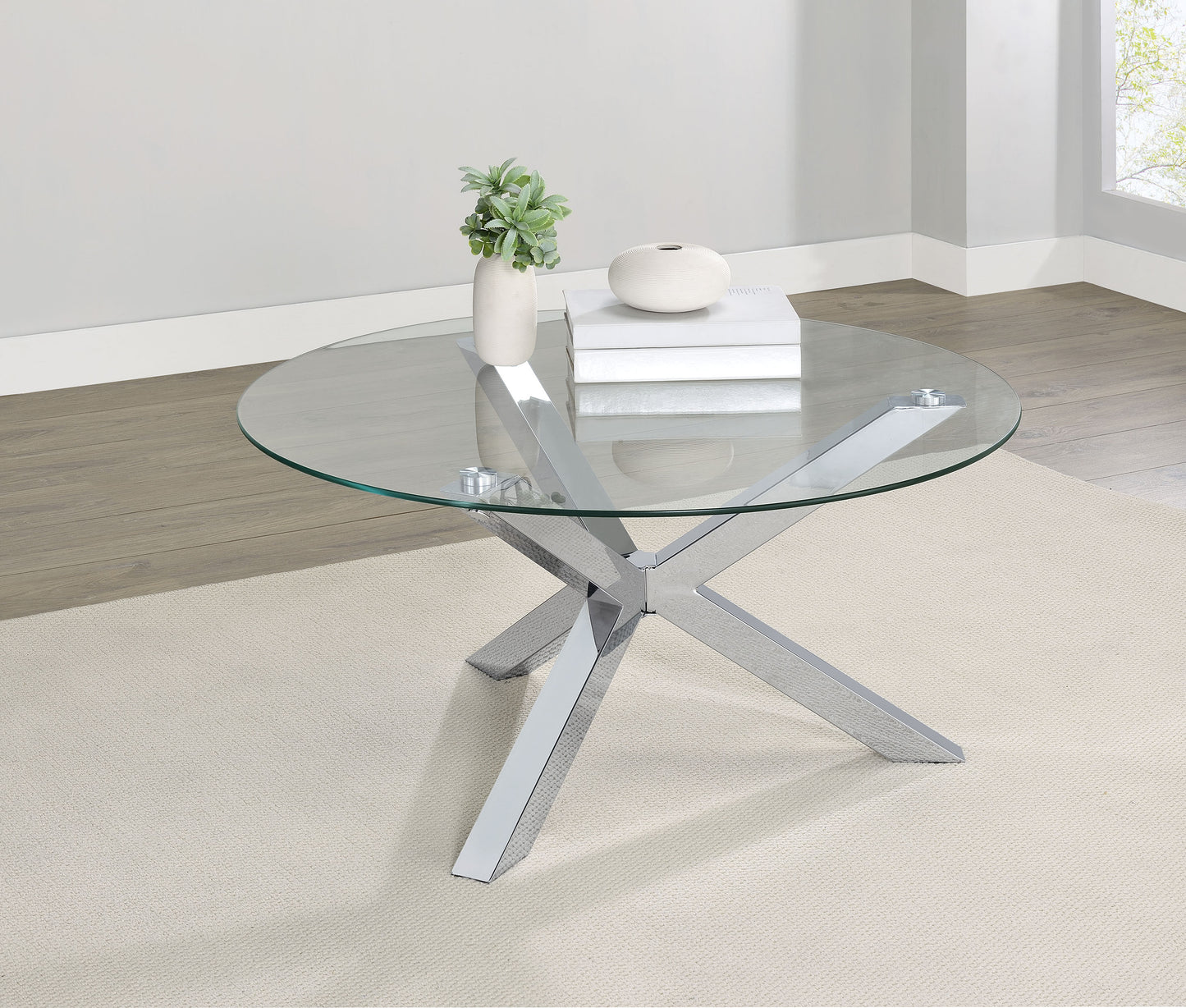 Mesa de centro redonda Kenzie con tapa de vidrio templado y acabado cromado