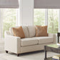 Loveseat tapizado con brazos inclinados Christine en beige